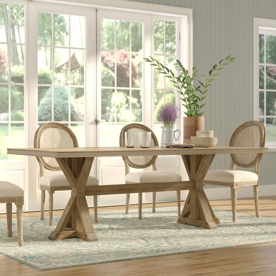 3D rendering of a farmhouse dining table by windows overlooking a garden